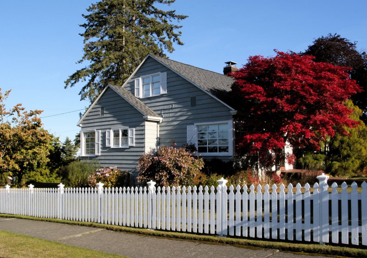 Older Home With White Picket Fence