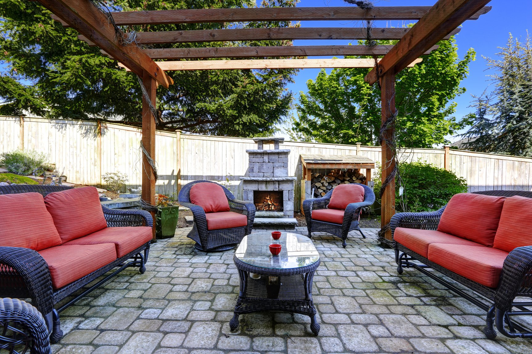 Home garden with patio area and fireplace